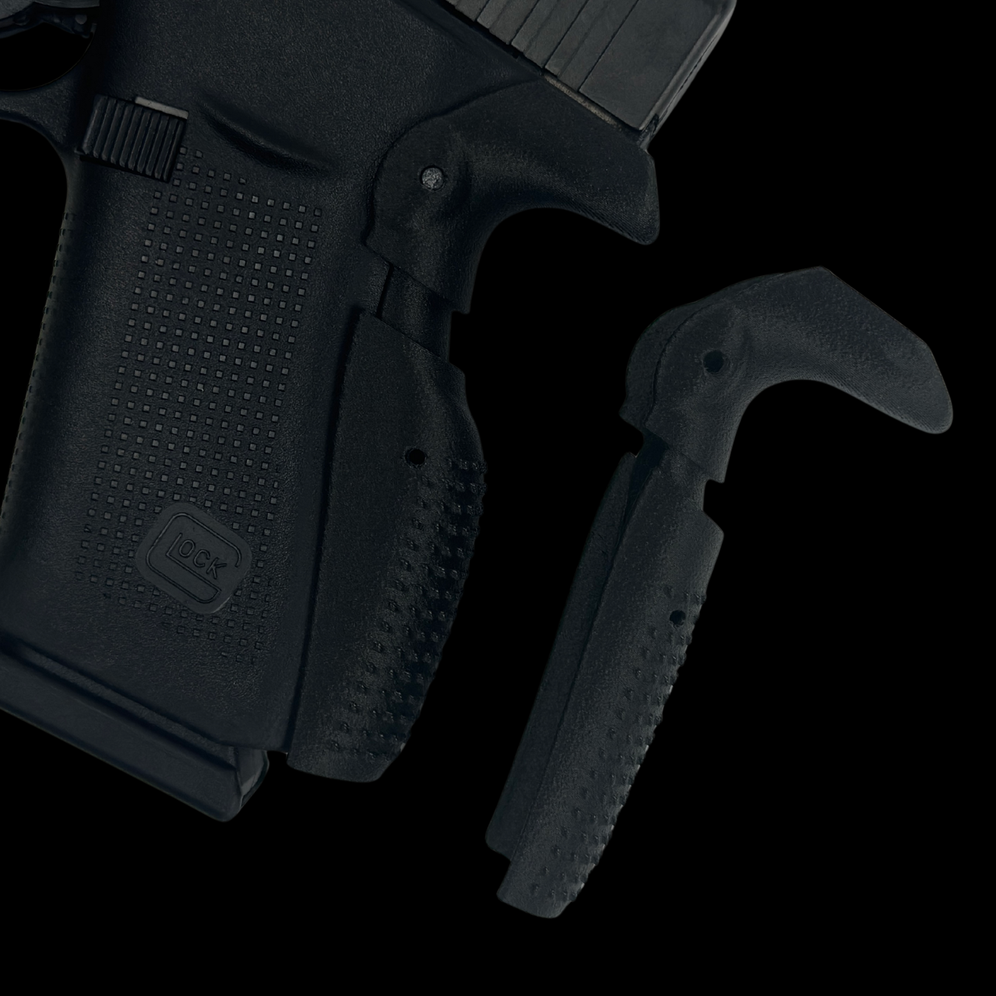 Black tactical grip extension for Glock pistol with ergonomic textured surface